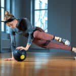 woman working out with medicine ball